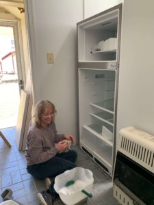 My mom cleaning the fridge. Pray for her as she and my dad adjust to me moving