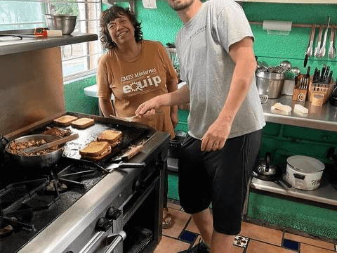 Joel and Juanis working in the kitchen during the Mexico trip