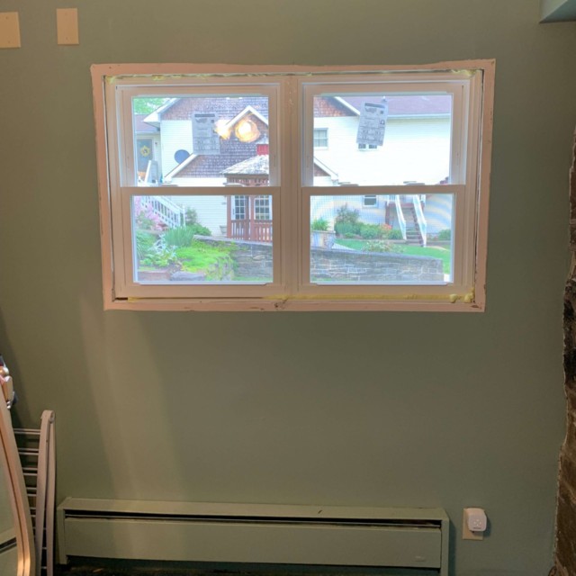 One (of the three) set(s) of new windows in my bedroom before they were finished. Thanks, Dad for getting them done!