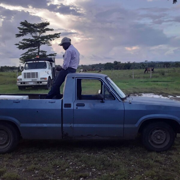 Rosvelt Thomasin sits on the Mazda waiting to go to the Thursday night church service (only two people fit in the cab).