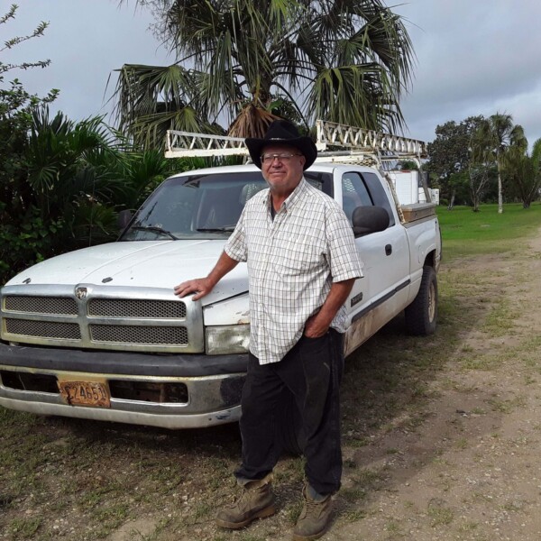 Andy with our new truck, and yes there is mud on the tires! This truck is a great help for us!