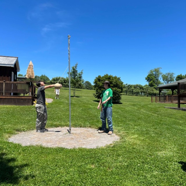 Gaddiel playing tetherball with Ace, David, and Kai at Three Springs Ministry on the CMTS Staff Retreat
