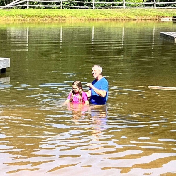 ... getting baptised! Super proud mama moment