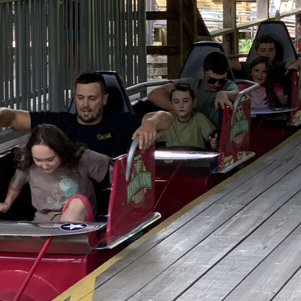 Joel and the 5 older kids on Flying Turns at Knoebels