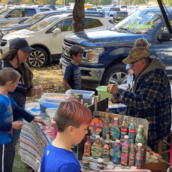 The kids making sand art at the Autumn Stroll
