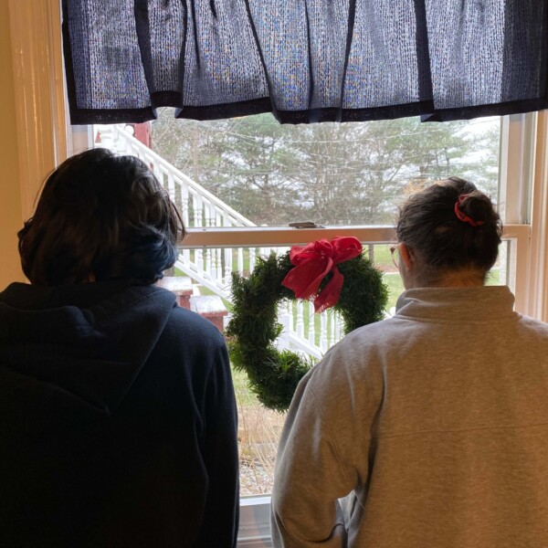 GrEmi watching the snow fall, hoping, praying that class will be canceled tonight