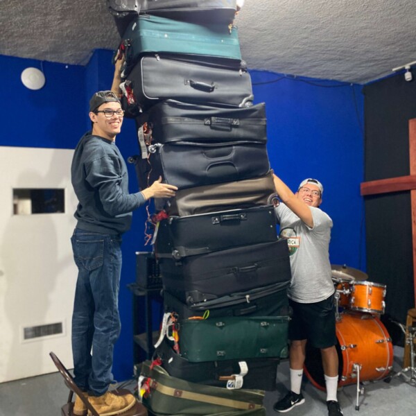 Kai & Alfredo stacking up the suitcases we brought with.
