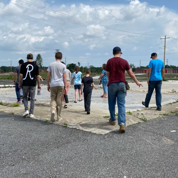 Walking an empty lot where a building used to stand
