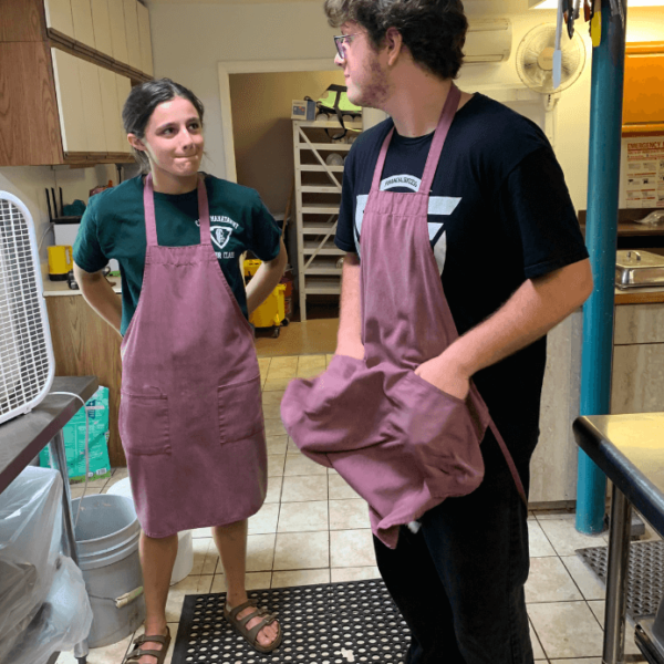 Sandra helping in the kitchen with Donovan.